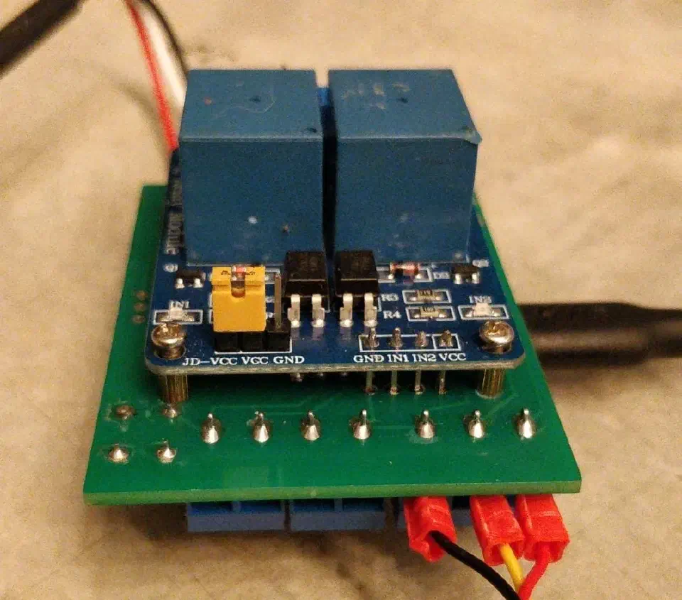 Two-channel relay module mounted on a Firefly circuit board