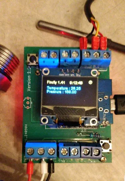 Firefly OLED screen showing temperature and pressure readings with sensors connected