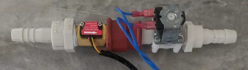 Inline water-flow sensor and electrically controlled valve connected with pipe fittings